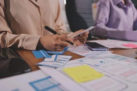 Close up ux developer and ui designer brainstorming about mobile app interf.. Foto stock