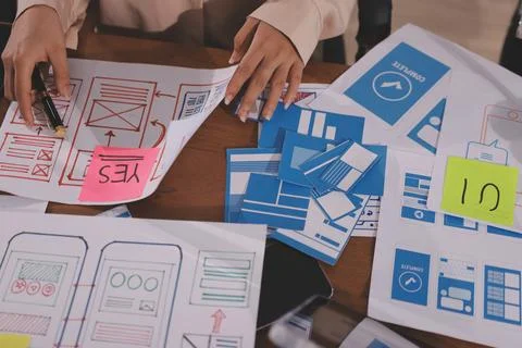 Close up ux developer and ui designer brainstorming about mobile app interf.. Foto stock
