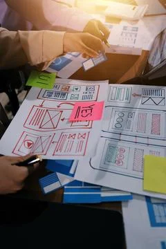 Close up ux developer and ui designer brainstorming about mobile app interf.. 写真素材