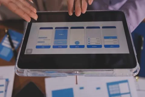 Close up ux developer and ui designer brainstorming about mobile app interf.. Foto stock