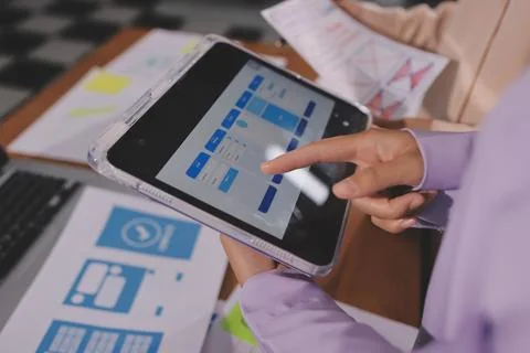 Close up ux developer and ui designer brainstorming about mobile app interf.. Foto stock