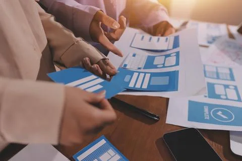 Close up ux developer and ui designer brainstorming about mobile app interf.. Foto stock