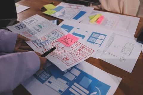 Close up ux developer and ui designer brainstorming about mobile app interf.. Foto stock