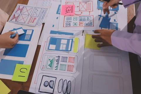 Close up ux developer and ui designer brainstorming about mobile app interf.. Foto stock