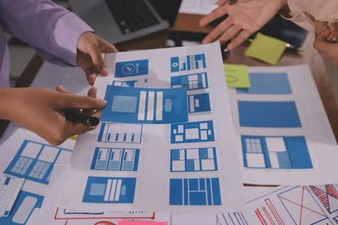 Close up ux developer and ui designer brainstorming about mobile app interf.. Foto stock