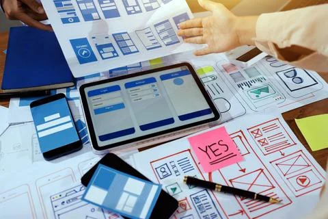 Close up ux developer and ui designer brainstorming about mobile app interf.. Foto stock