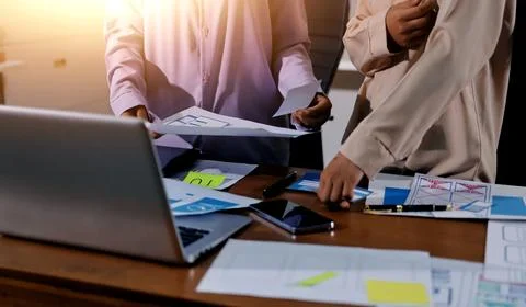 Close up ux developer and ui designer brainstorming about mobile app interf.. Foto stock