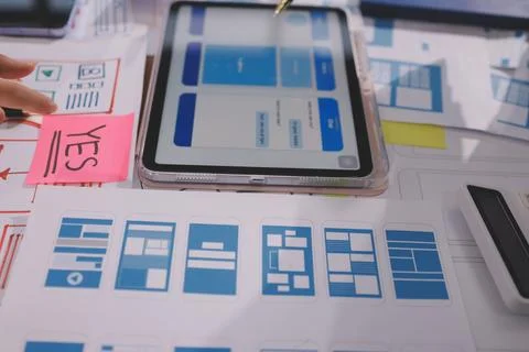 Close up ux developer and ui designer brainstorming about mobile app interf.. Foto stock