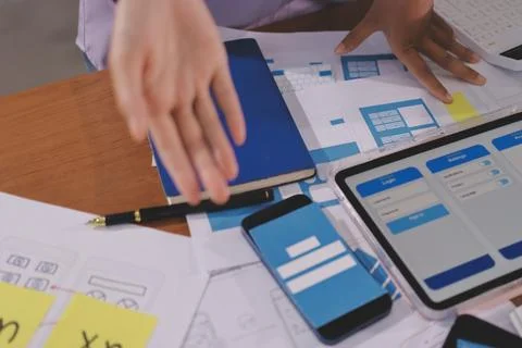 Close up ux developer and ui designer brainstorming about mobile app interf.. 스톡 사진