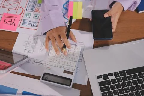 Close up ux developer and ui designer brainstorming about mobile app interf.. Foto stock