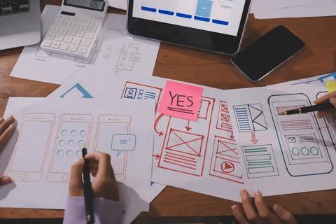 Close up ux developer and ui designer brainstorming about mobile app interf.. Foto stock