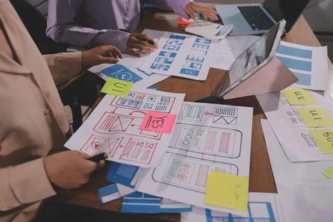 Close up ux developer and ui designer brainstorming about mobile app interf.. Foto stock