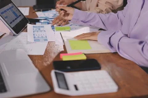Close up ux developer and ui designer brainstorming about mobile app interf.. Foto stock
