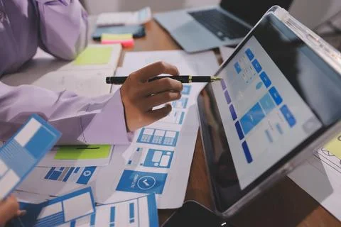 Close up ux developer and ui designer brainstorming about mobile app interf.. Foto stock