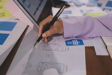 Close up ux developer and ui designer brainstorming about mobile app interf.. Foto stock