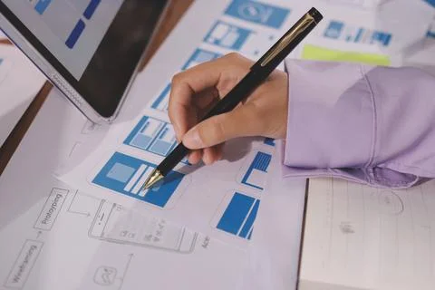 Close up ux developer and ui designer brainstorming about mobile app interf.. Foto stock
