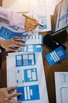 Close up ux developer and ui designer brainstorming about mobile app interf.. Foto stock