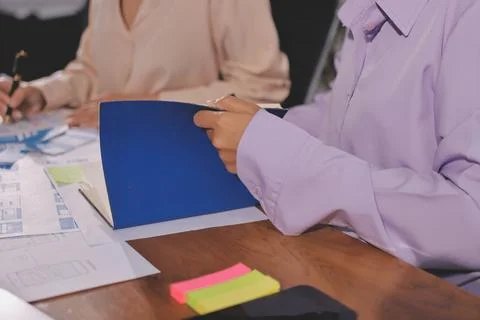 Close up ux developer and ui designer brainstorming about mobile app interf.. Foto stock