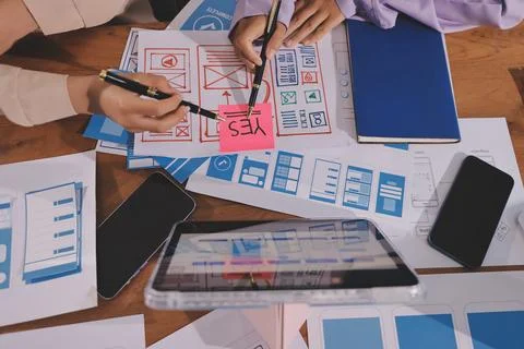Close up ux developer and ui designer brainstorming about mobile app interf.. Foto stock