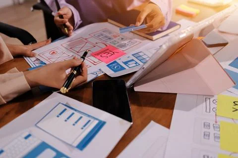 Close up ux developer and ui designer brainstorming about mobile app interf.. 스톡 사진