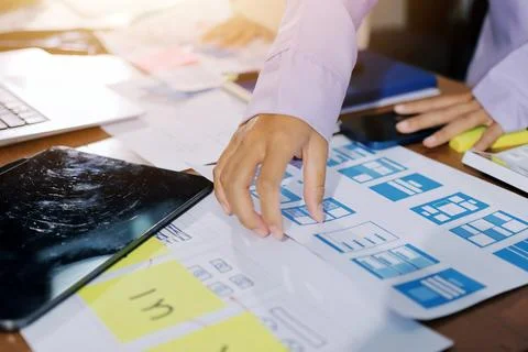 Close up ux developer and ui designer brainstorming about mobile app interf.. Foto stock
