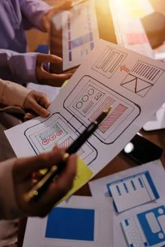 Close up ux developer and ui designer brainstorming about mobile app interf.. Foto stock