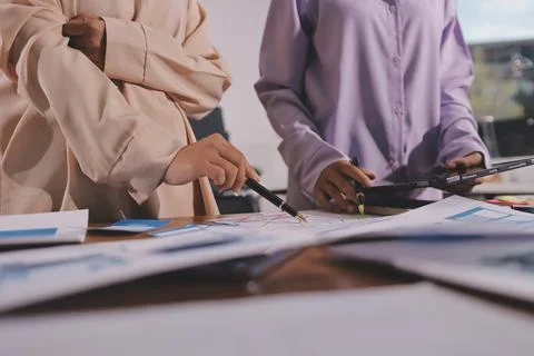 Close up ux developer and ui designer brainstorming about mobile app interf.. Stock Photos