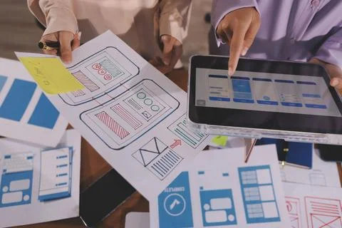Close up ux developer and ui designer brainstorming about mobile app interf.. Foto stock