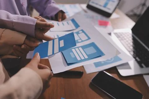 Close up ux developer and ui designer brainstorming about mobile app interf.. Foto stock