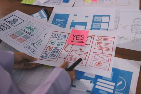 Close up ux developer and ui designer brainstorming about mobile app interf.. Foto stock