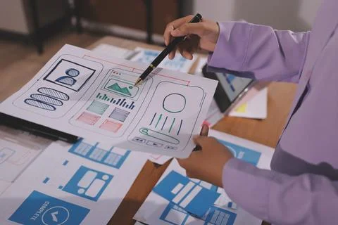 Close up ux developer and ui designer brainstorming about mobile app interf.. Foto stock