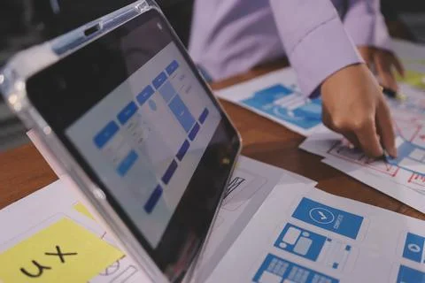 Close up ux developer and ui designer brainstorming about mobile app interf.. Foto stock