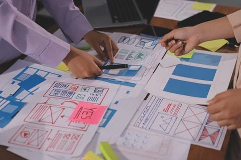 Close up ux developer and ui designer brainstorming about mobile app interf.. Foto stock