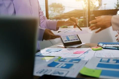 Close up ux developer and ui designer brainstorming about mobile app interf.. Foto stock