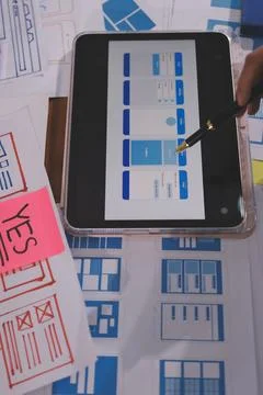 Close up ux developer and ui designer brainstorming about mobile app interf.. Foto stock