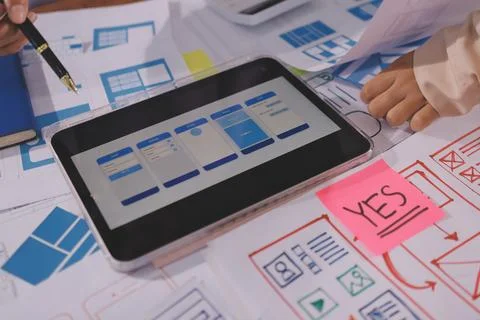 Close up ux developer and ui designer brainstorming about mobile app interf.. Foto stock