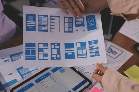 Close up ux developer and ui designer brainstorming about mobile app interf.. Foto stock