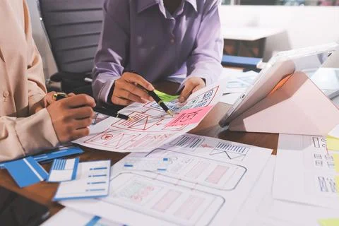 Close up ux developer and ui designer brainstorming about mobile app interf.. 스톡 사진