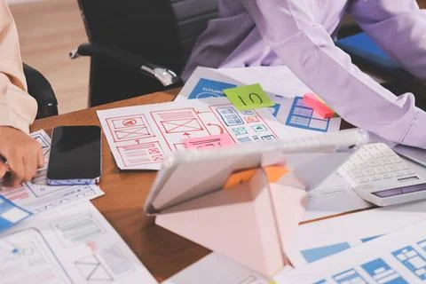 Close up ux developer and ui designer brainstorming about mobile app interf.. 스톡 사진