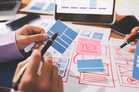 Close up ux developer and ui designer brainstorming about mobile app interf.. 스톡 사진