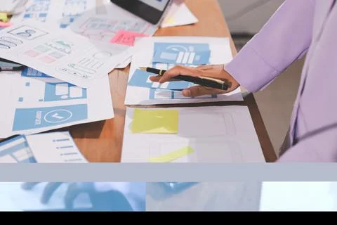 Close up ux developer and ui designer brainstorming about mobile app interf.. 스톡 사진