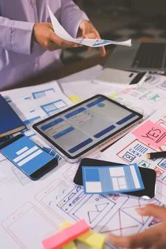 Close up ux developer and ui designer brainstorming about mobile app interf.. 스톡 사진