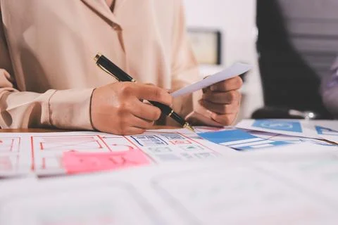 Close up ux developer and ui designer brainstorming about mobile app interf.. 스톡 사진