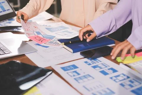 Close up ux developer and ui designer brainstorming about mobile app interf.. 스톡 사진