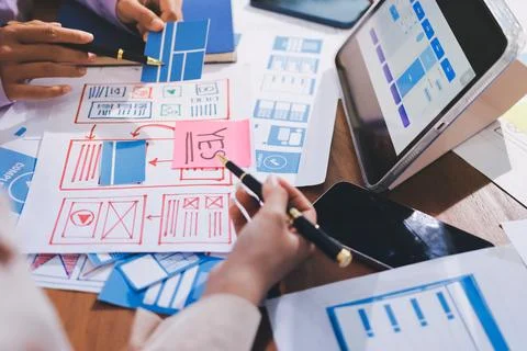 Close up ux developer and ui designer brainstorming about mobile app interf.. Foto stock