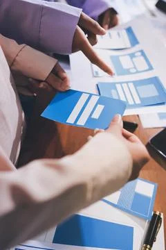 Close up ux developer and ui designer brainstorming about mobile app interf.. Stock Photos