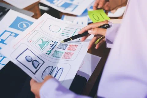 Close up ux developer and ui designer brainstorming about mobile app interf.. Stock Photos