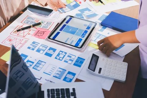 Close up ux developer and ui designer brainstorming about mobile app interf.. Stock Photos