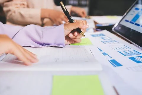 Close up ux developer and ui designer brainstorming about mobile app interf.. Stock Photos