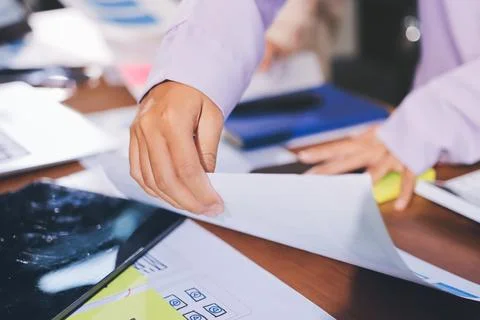 Close up ux developer and ui designer brainstorming about mobile app interf.. Stock Photos